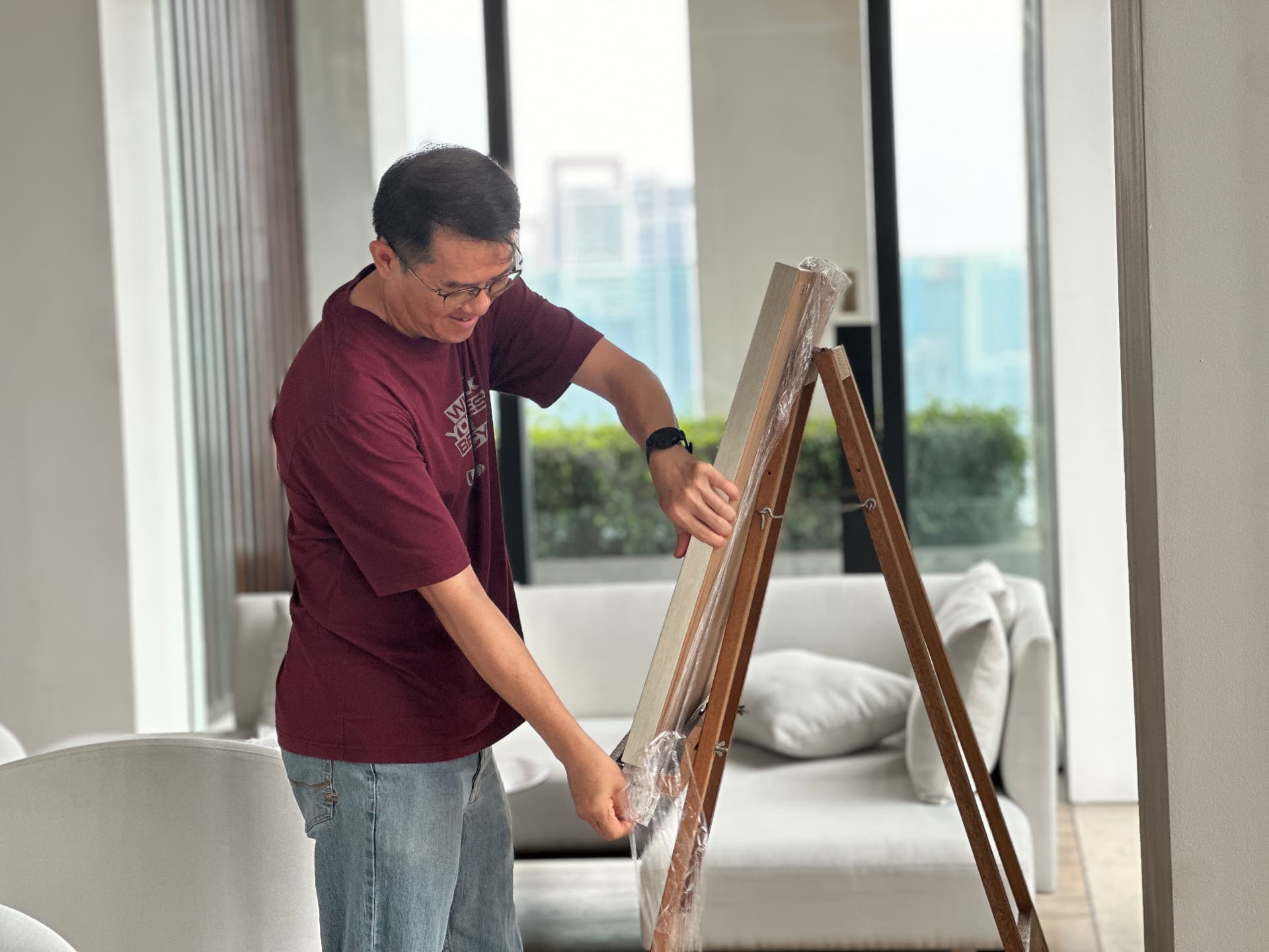 Preparing a wooden easel during the exhibition setup