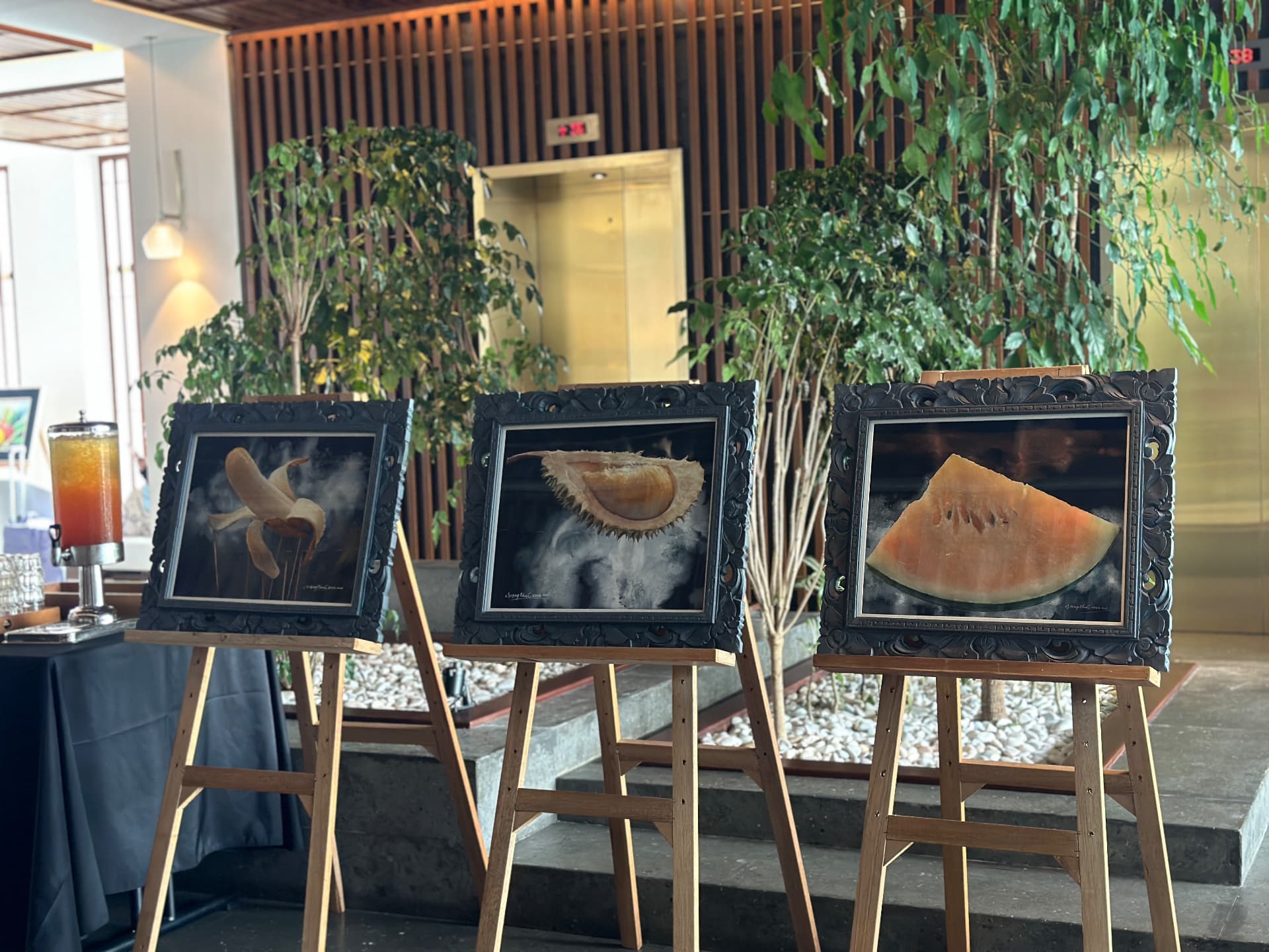 The completed display of banana, durian and watermelon paintings in the hotel lobby